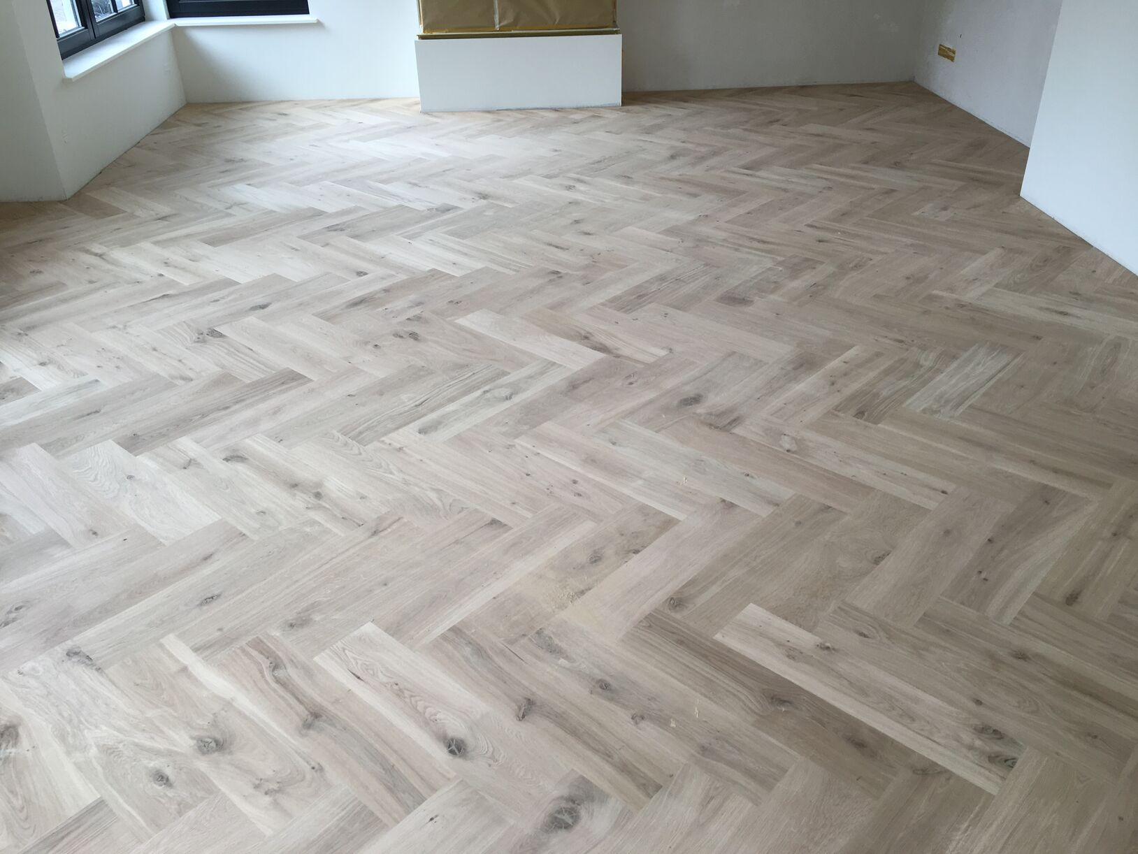 Kun je vloerverwarming met een houten visgraat vloer combineren?